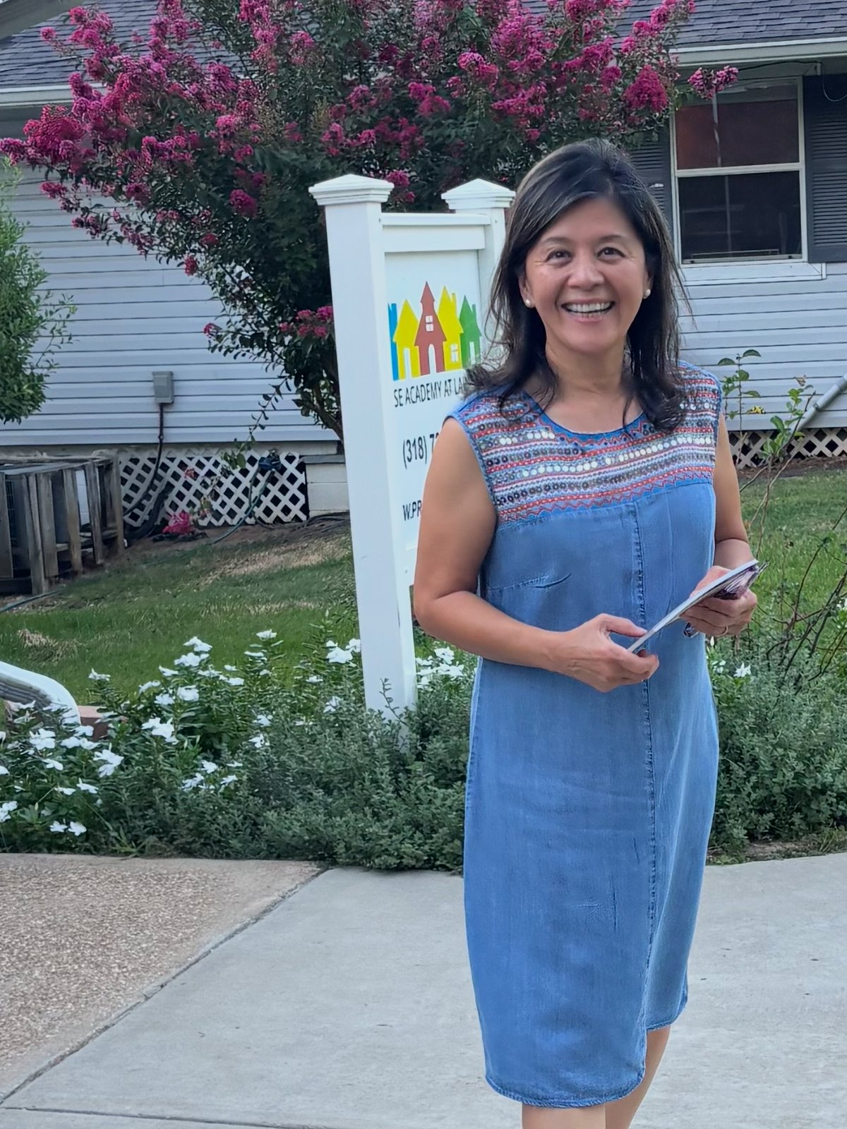 Hanh Williams walking a Lakeside street in Shreveport while canvassing for City Council District A, September 15, 2026