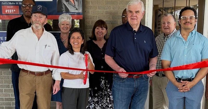 Hanh Williams cutting the ribbon at the District A campaign office with Foster Campbell and supporters, September 28, 2026